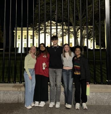 Health Science Complexities students outside the White House at night